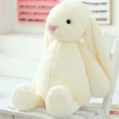 Cream plush bunny stuffed toy for babies, soft cuddly rabbit with long ears on a white chair on Tampa Home & Garden Store