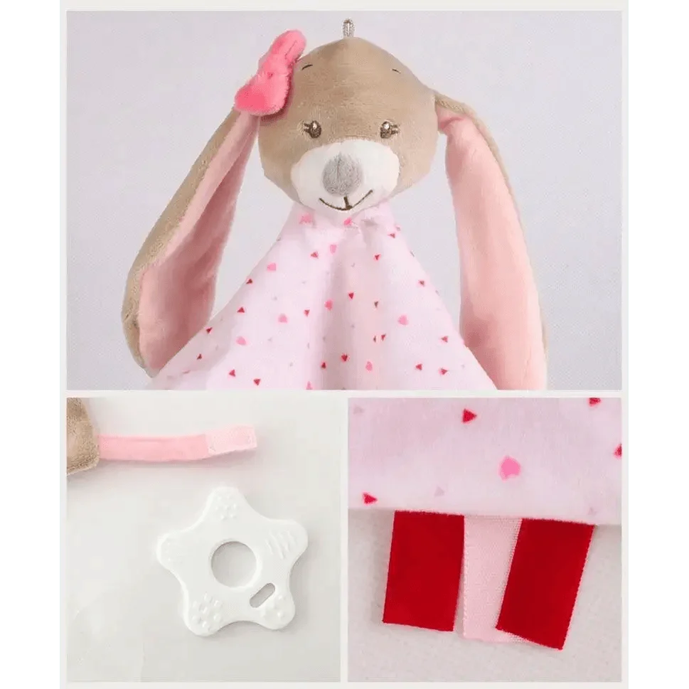 Stuffed bunny plush toy with pink ears and heart-print blanket; white star-shaped pacifier clip on Tampa Home & Garden Store