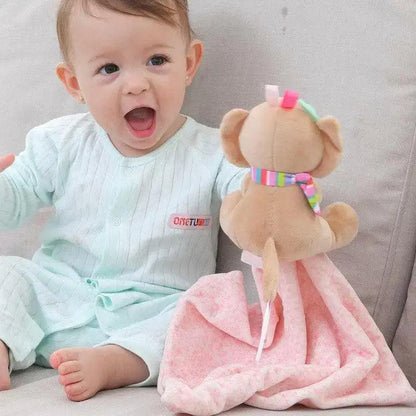 Soft plush rabbit toy beige with rainbow scarf beside smiling infant and pink blanket on Tampa Home & Garden Store