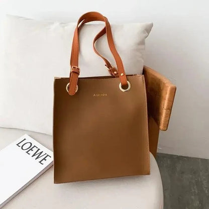 Stevvex brown leather retro shoulder bag with gold-tone rings and double top handles on Tampa Home & Garden Store