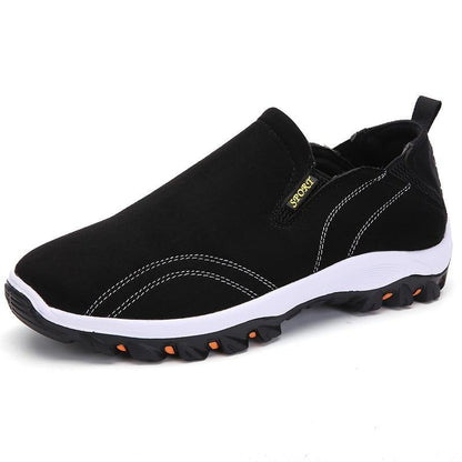Stevvex men's slip-on sport sneakers, black upper, white sole, orange-outsole accents on Tampa Home & Garden Store