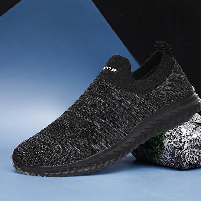 Stevvex slip-on sneakers with black knit upper and rugged outsole for casual walking on Tampa Home & Garden Store