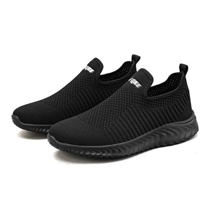 Stevvex black knit slip-on sneakers with mesh upper and ribbed outsole; two shoes on Tampa Home & Garden Store