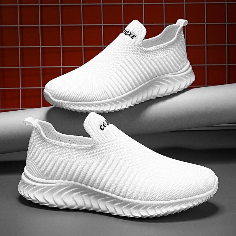 Stevvex white slip-on sneakers with knit upper and zigzag sole pair on Tampa Home & Garden Store