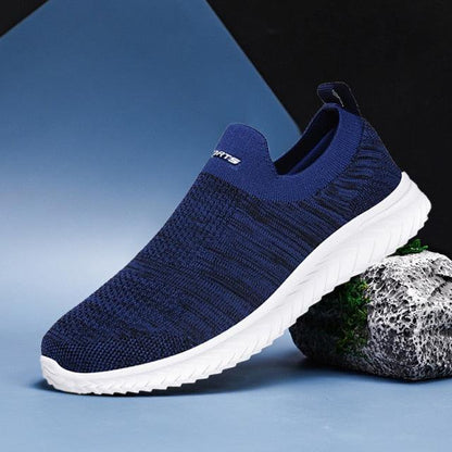 Navy knit slip-on sneaker with white outsole, lightweight casual walking shoe on Tampa Home & Garden Store
