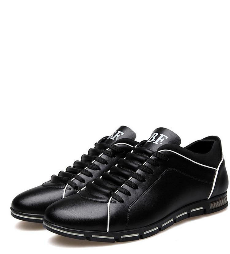 Pair of Stevvex men's black leather sneakers with white piping, lace-up, round toe on Tampa Home & Garden Store