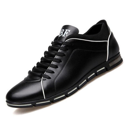 Stevvex men's black leather sneakers with white piping and segmented sole on Tampa Home & Garden Store
