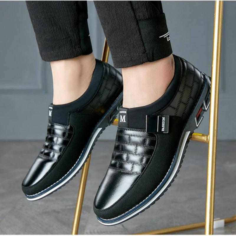 Stevvex mens leather casual sneakers in black with stitched panels and sporty sole on Tampa Home & Garden Store