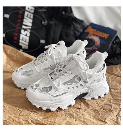 Pair of men's white Stevvex sneakers with breathable mesh and chunky sole on Tampa Home & Garden Store