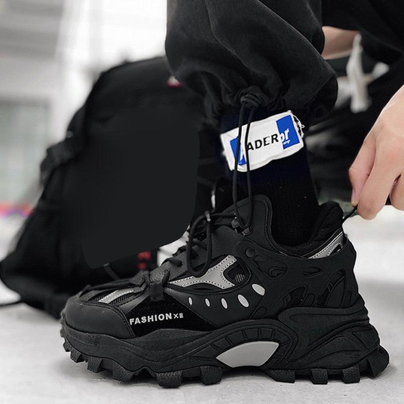 Men's black chunky sneakers with thick sole, layered panels, breathable streetwear style on Tampa Home & Garden Store