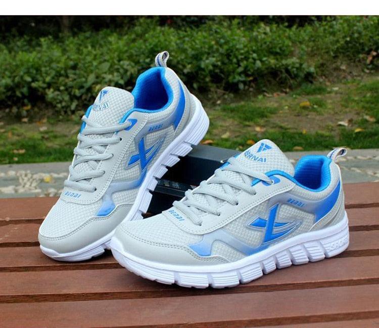 Stevvex men's sport light sneakers, breathable white mesh with blue accents lace-up on Tampa Home & Garden Store
