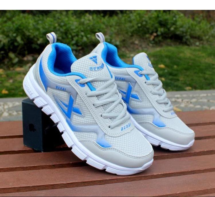 Stevvex men's breathable lightweight sneakers with blue accents, mesh upper, lace-up pair on Tampa Home & Garden Store