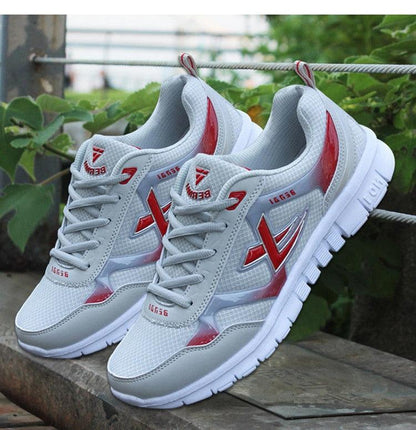 Stevvex men's sport light sneakers, white breathable mesh with red accents, pair shown on Tampa Home & Garden Store