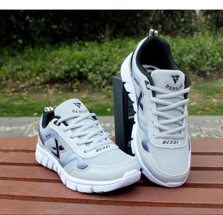 Stevvex men's sport light sneakers breathable mesh casual walking shoes white gray pair on Tampa Home & Garden Store