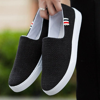 Casual flat canvas slip-on sneakers, black canvas upper with white sole on Tampa Home & Garden Store