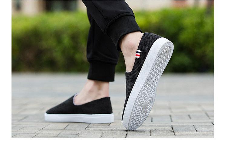 Stevvex black canvas slip-on sneakers with white sole and striped heel tab on Tampa Home & Garden Store