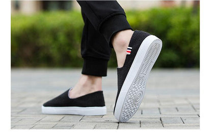 Stevvex black canvas slip-on sneakers with white sole and striped heel tab on Tampa Home & Garden Store
