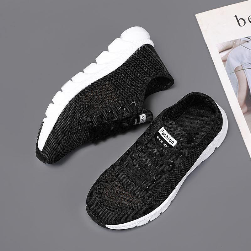 Stevvex women's black mesh sneakers pair, breathable walking shoes with white sole on Tampa Home & Garden Store