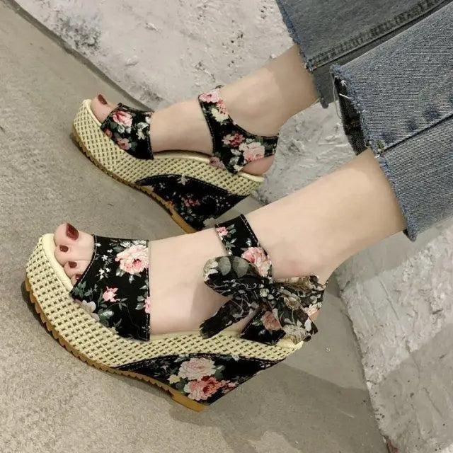 Floral wedge sandals pair with black fabric straps, pink flowers, rope-wrapped platform Stevvex on Tampa Home & Garden Store