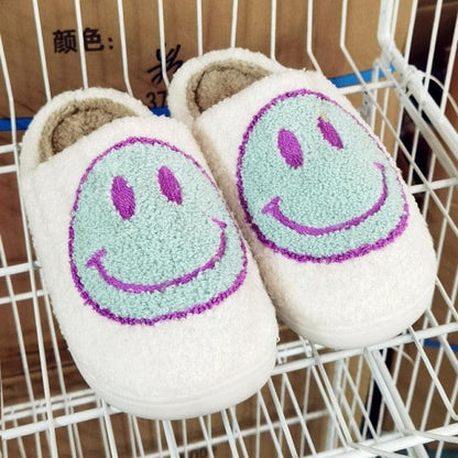 Stevvex Women’s Pink Smiley Face Slippers, plush white fur-lined slip-ons with teal smiley print on Tampa Home & Garden Store