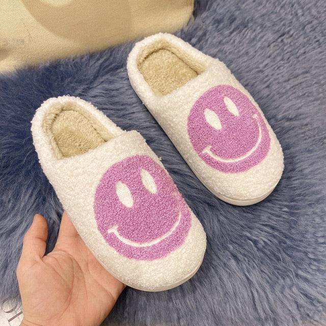 Stevvex pink smiley face plush slippers, white fluffy slip-ons with purple smiley, indoor pair on Tampa Home & Garden Store
