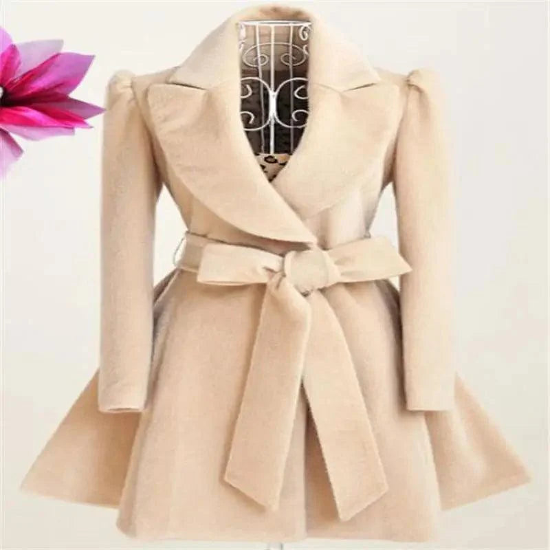 Beige women's woolen windbreaker overcoat with wide lapels and belt on mannequin on Tampa Home & Garden Store