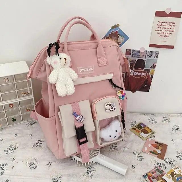 Stevvex pink waterproof school backpack with multiple pockets and plush teddy bear charm on Tampa Home & Garden Store