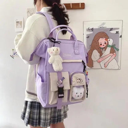 Stevvex ALU92987KLM purple waterproof backpack with beige front pockets, plush keychain on Tampa Home & Garden Store