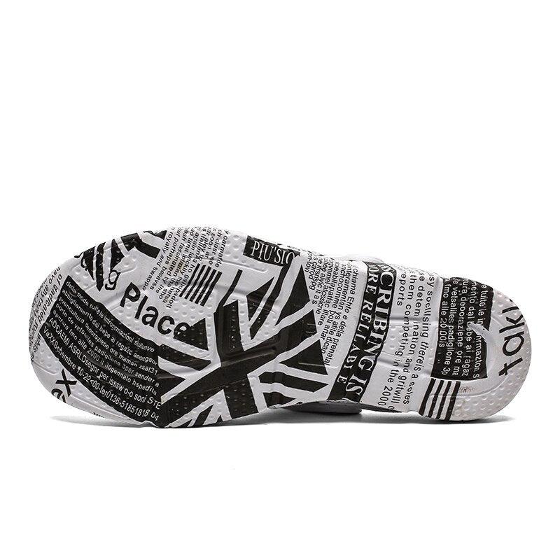 Stevvex sandals bottom view with black-white newspaper print sole pattern on Tampa Home & Garden Store