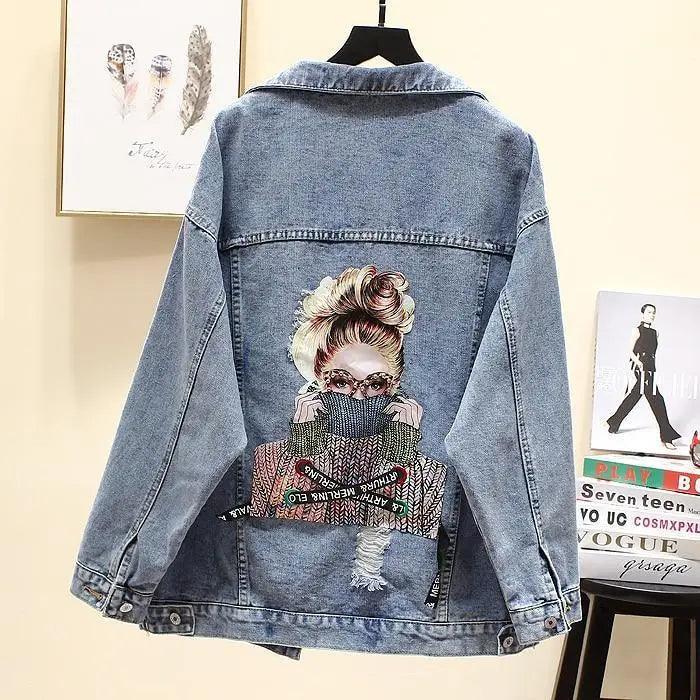 Stevvex blue denim trucker jacket with back art of a woman and ripped patch on Tampa Home & Garden Store