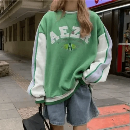 Stevvex oversized green crew-neck sweatshirt with white raglan sleeves and retro print on Tampa Home & Garden Store