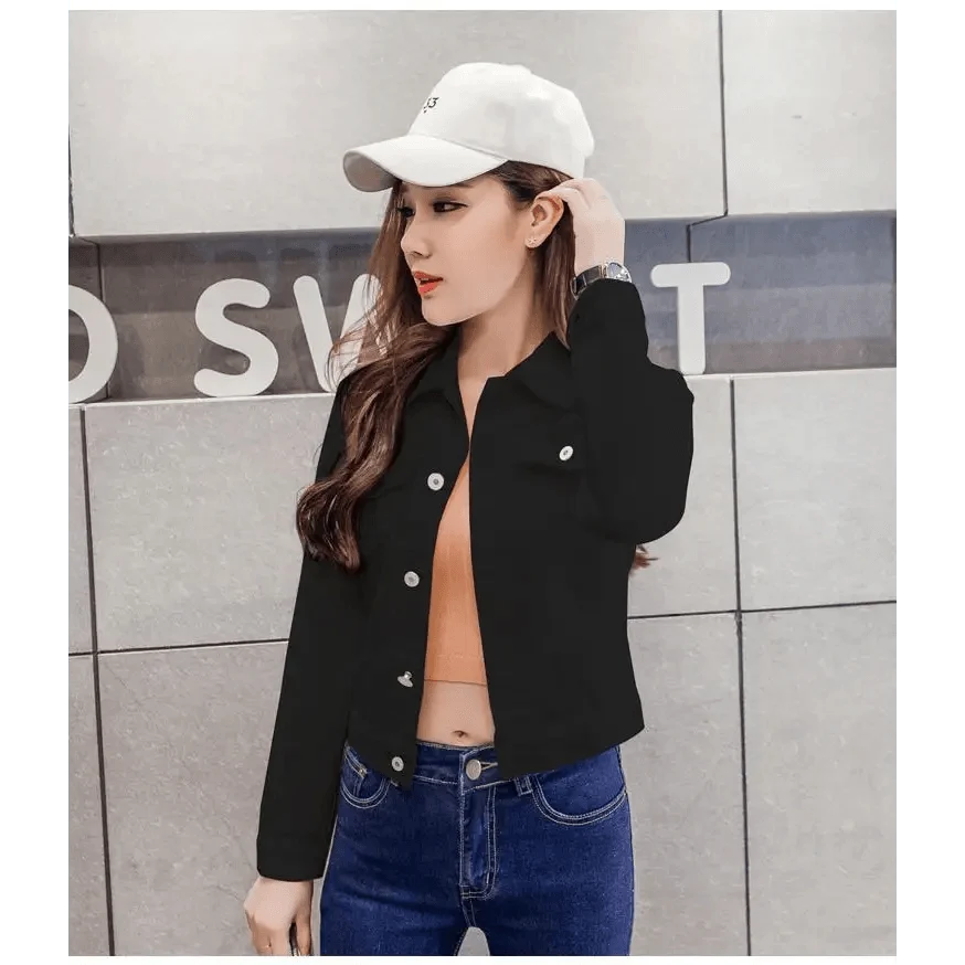 Denim trucker jacket by Stevvex, cropped black with silver snaps over a peach top and blue jeans on Tampa Home & Garden Store