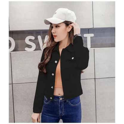 Denim trucker jacket by Stevvex, cropped black with silver snaps over a peach top and blue jeans on Tampa Home & Garden Store