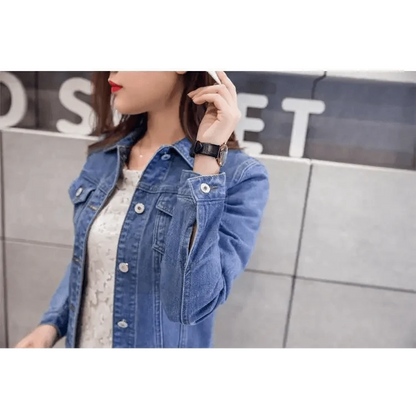 Blue denim trucker jacket Stevvex with long sleeves over a white lace top on Tampa Home & Garden Store