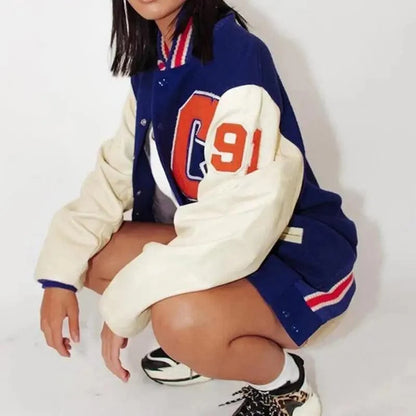 Stevvex windbreaker jacket in blue body with cream sleeves and orange 91 patch on Tampa Home & Garden Store