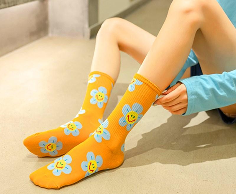 Women's Stevvex crew socks orange with blue flowers and smiling faces, breathable kawaii style on Tampa Home & Garden Store