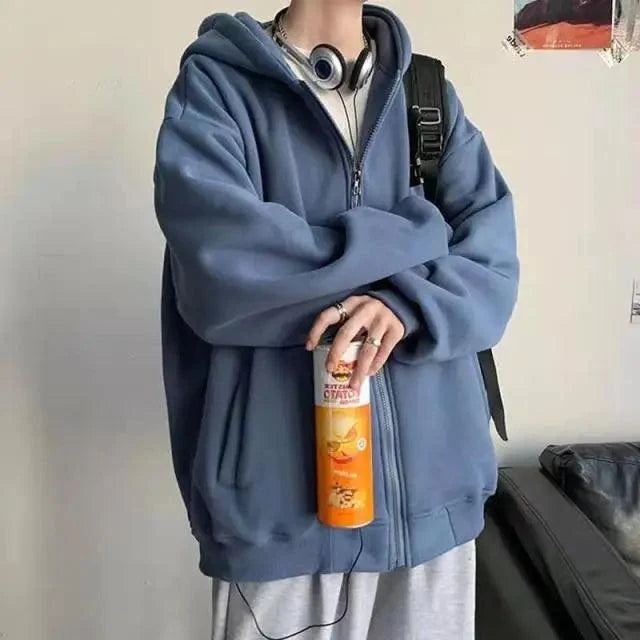 Stevvex blue fleece hooded sweatshirt worn by person with backpack, holding orange bottle on Tampa Home & Garden Store