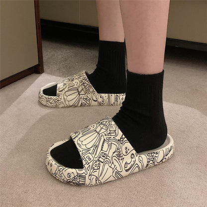 Stevvex Soft Eva Light Sandal slippers with white EVA and black doodle print pair shown on Tampa Home & Garden Store
