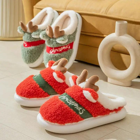 Stevvex red plush Christmas deer slippers with antlers; green pair behind on Tampa Home & Garden Store