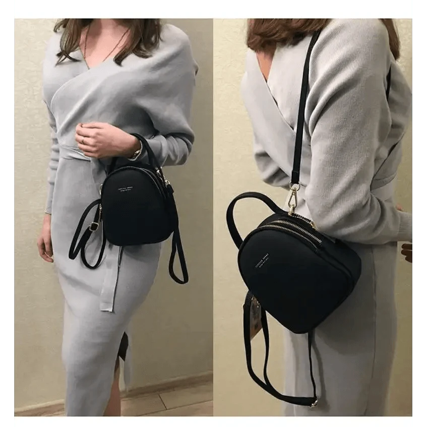 Stevvex black leather backpack with gold zippers and adjustable strap worn as crossbody on Tampa Home & Garden Store