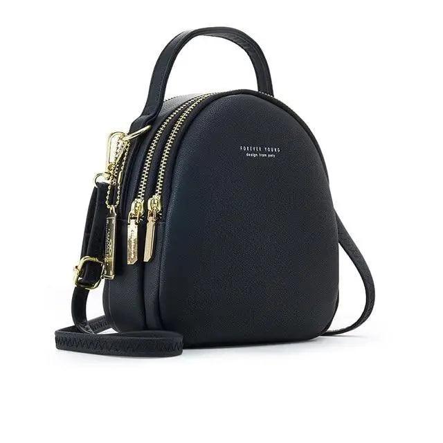 Women’s black backpack with gold zippers, top handle, crossbody strap Forever Young on Tampa Home & Garden Store