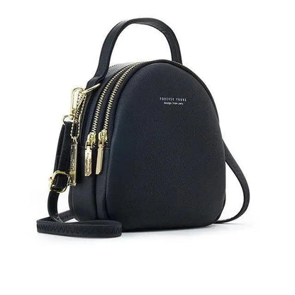 Women’s black backpack with gold zippers, top handle, crossbody strap Forever Young on Tampa Home & Garden Store