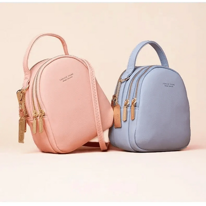 Stevvex two pastel pink and blue soft leather three-layer backpacks with gold zippers on Tampa Home & Garden Store