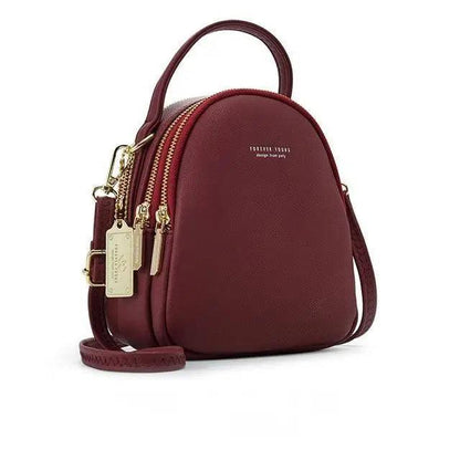 Backpack Stevvex burgundy leather with crossbody strap and gold hardware on Tampa Home & Garden Store