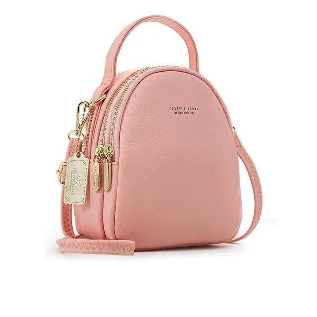 Stevvex pink soft leather mini backpack with top handle, gold zippers, crossbody strap on Tampa Home & Garden Store