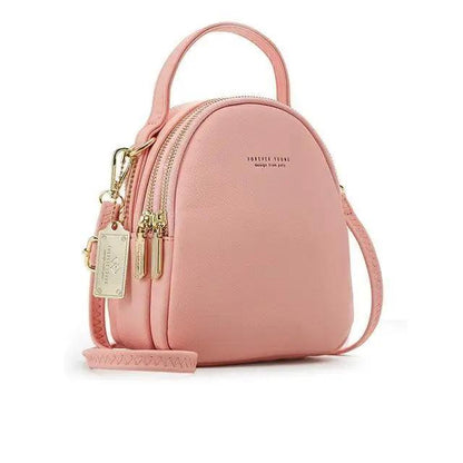 Stevvex pink soft leather mini backpack with top handle, gold zippers, crossbody strap on Tampa Home & Garden Store