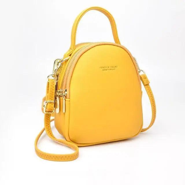 Stevvex yellow soft leather 3-layer women's backpack with top handle and crossbody strap on Tampa Home & Garden Store