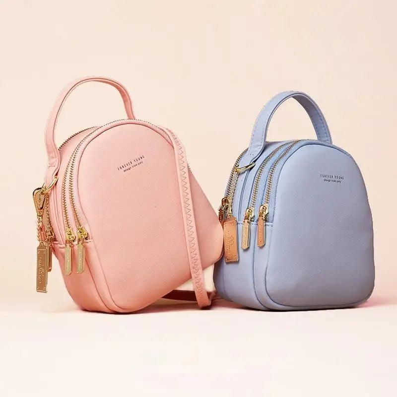 Stevvex ST93120DEF women's backpack pair in pink and blue with gold zippers on Tampa Home & Garden Store