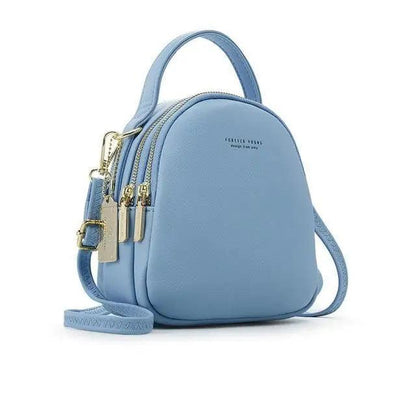 Stevvex light blue soft leather mini backpack with top handle and triple-zip compartments on Tampa Home & Garden Store
