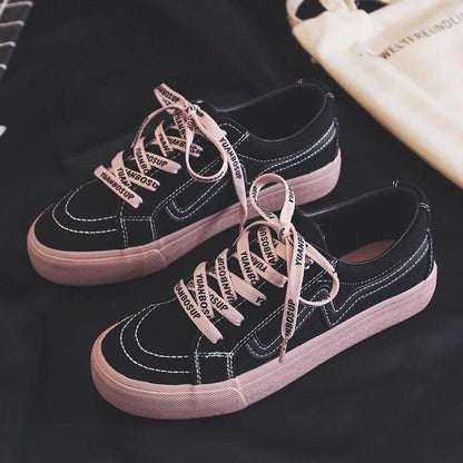 Stevvex women's black canvas sneakers, low-top lace-up pair with pink sole and white stitching on Tampa Home & Garden Store